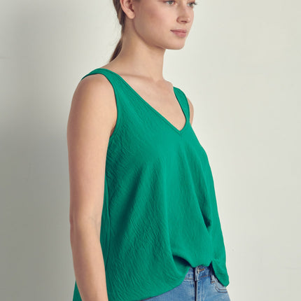 V-neck sleeveless knotted front hi-low top
